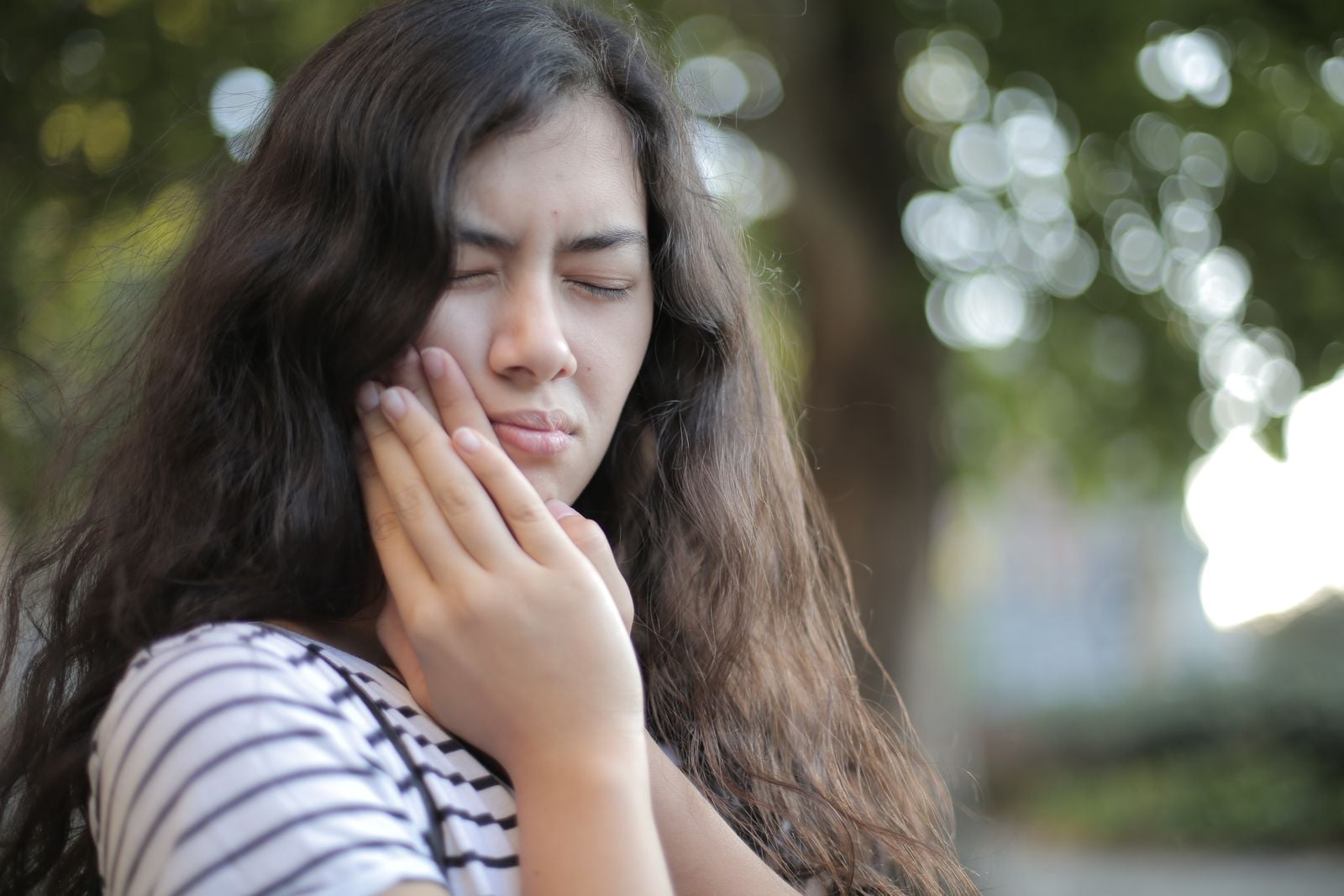 Person with jaw and facial discomfort