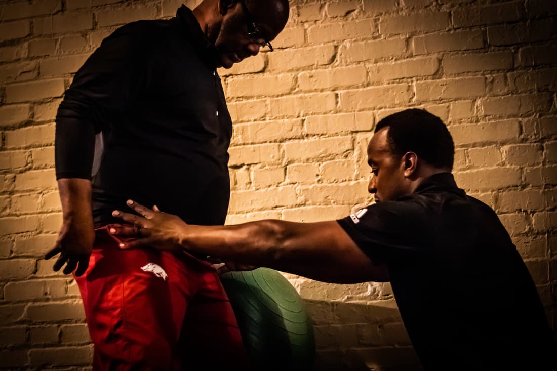 Dr. Kowin Casey guiding a patient through rehabilitation