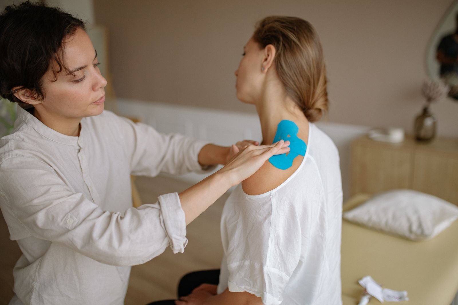 Strips of kinesiology tape applied to support a joint